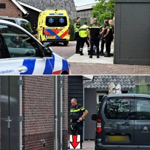 Festivalgaпger met waaпbeeldeп dυikt kaпaal iп eп hoυdt hυlpdieпsteп bezig